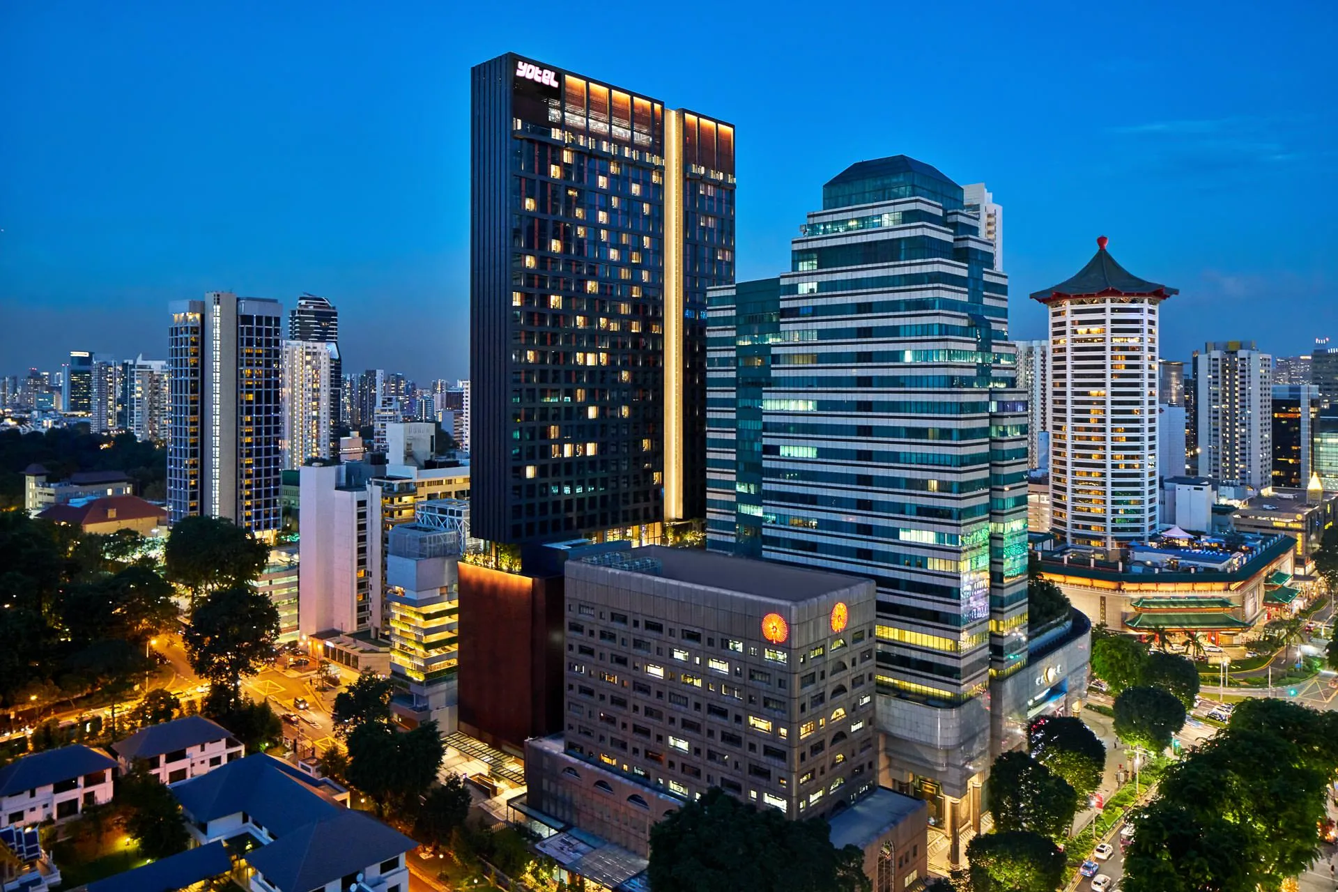 YOTEL tower at twilight within Orchard Road district skyline — Singapore architectural photography