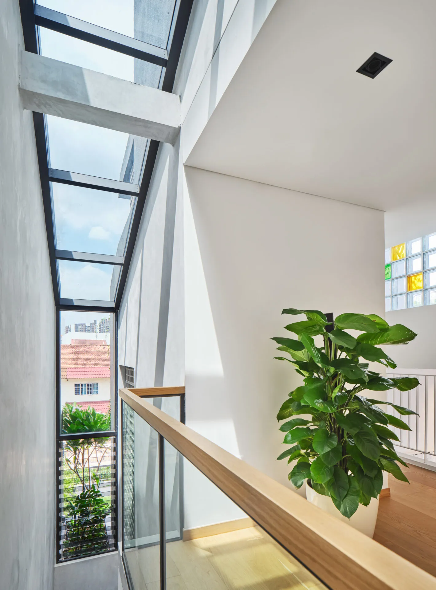Living area with large windows and soft natural light in modern home.