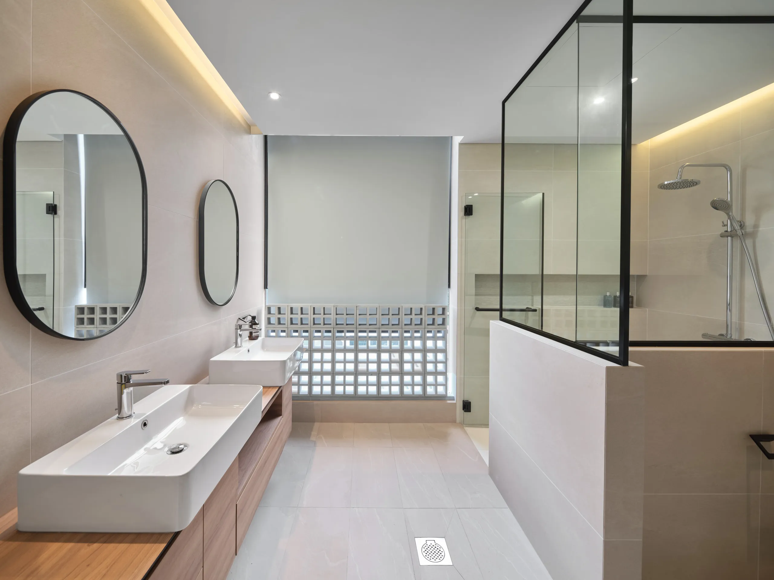 Luxury bathroom with glass shower – residential interior photography.