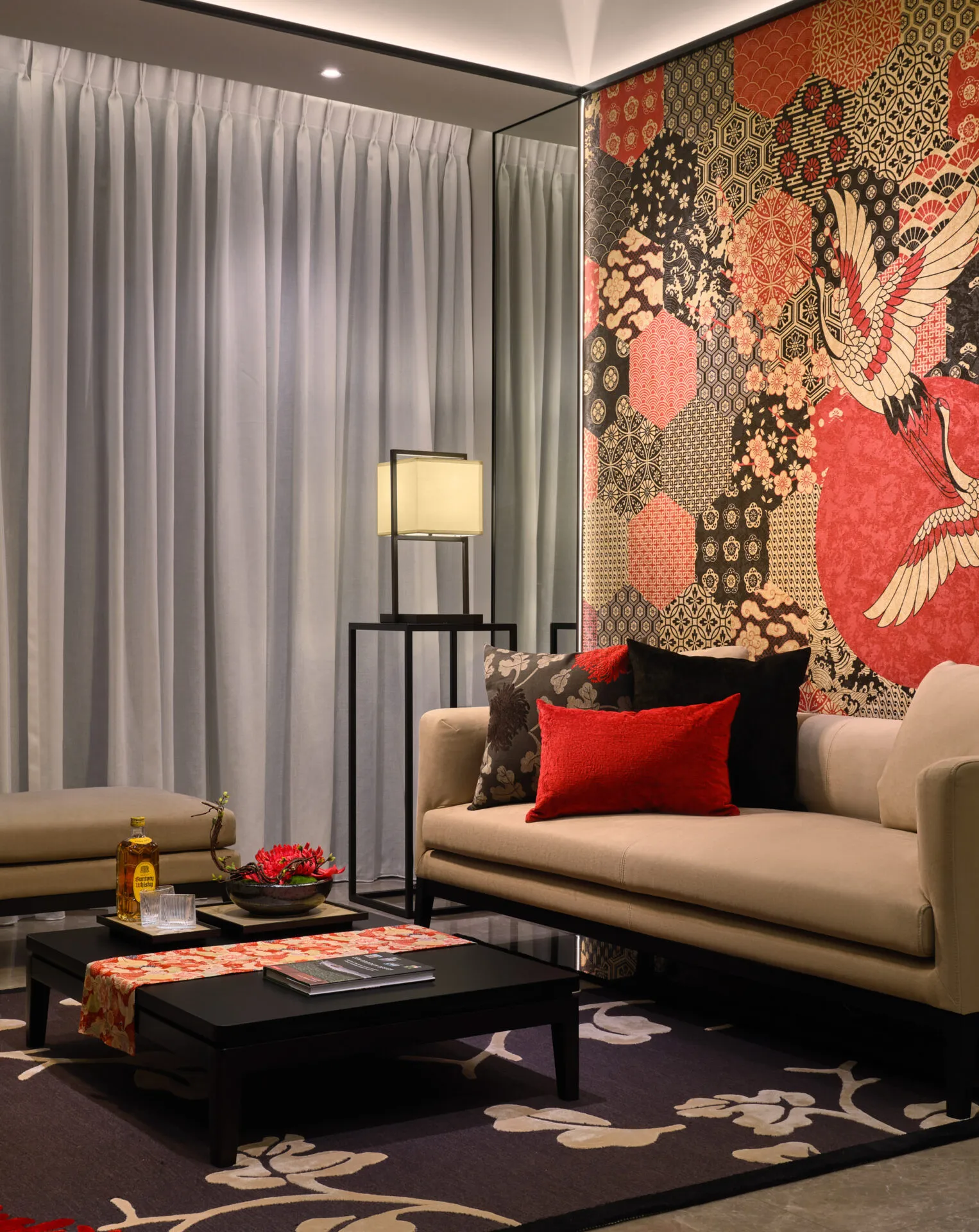 Detail with brocade pillow, spider lily arrangement and warm lamp glow — Boulevard 88 Singapore interior photography