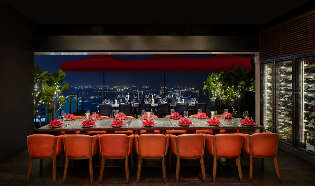 Ce-La-Vi-Singapore-Bar-View-with-Orange-Chairs-and-Skyline