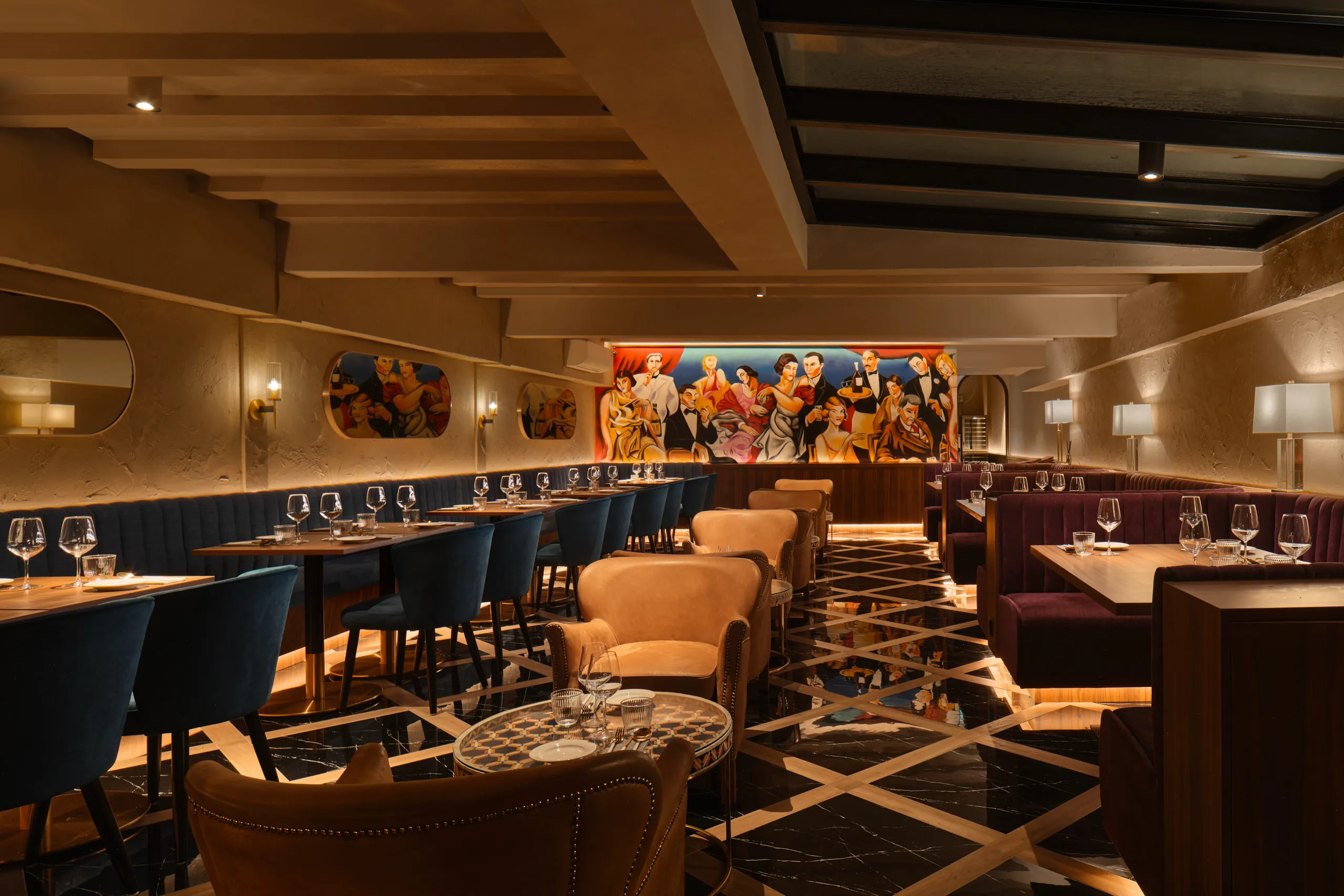 F&B interior design at Gotti Singapore, featuring a refined dining space with plush seating and a bold mural as the focal point.
