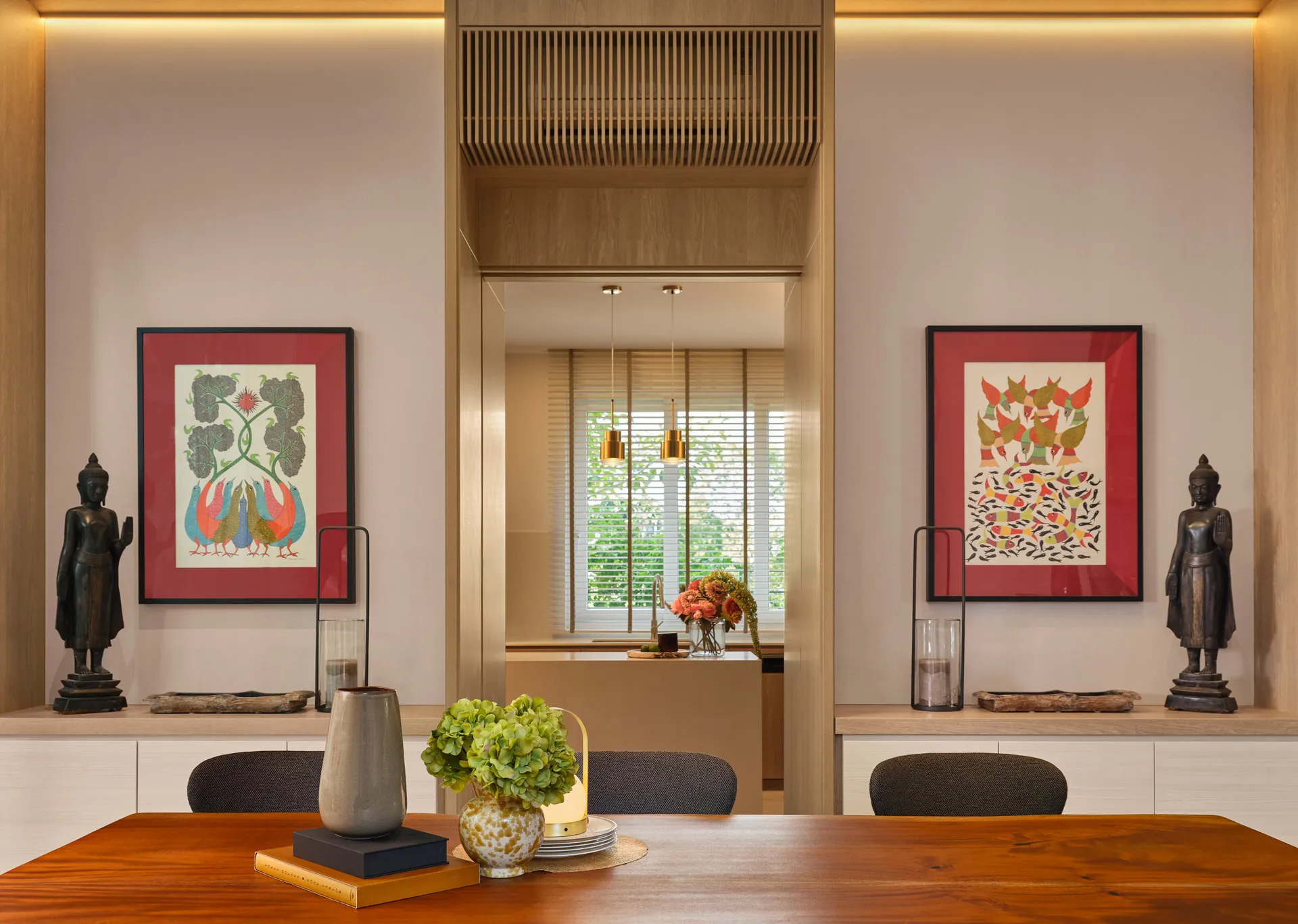 Dining room with Buddha niches, folk art and slatted timber screen — Holland Green Singapore interior design photography