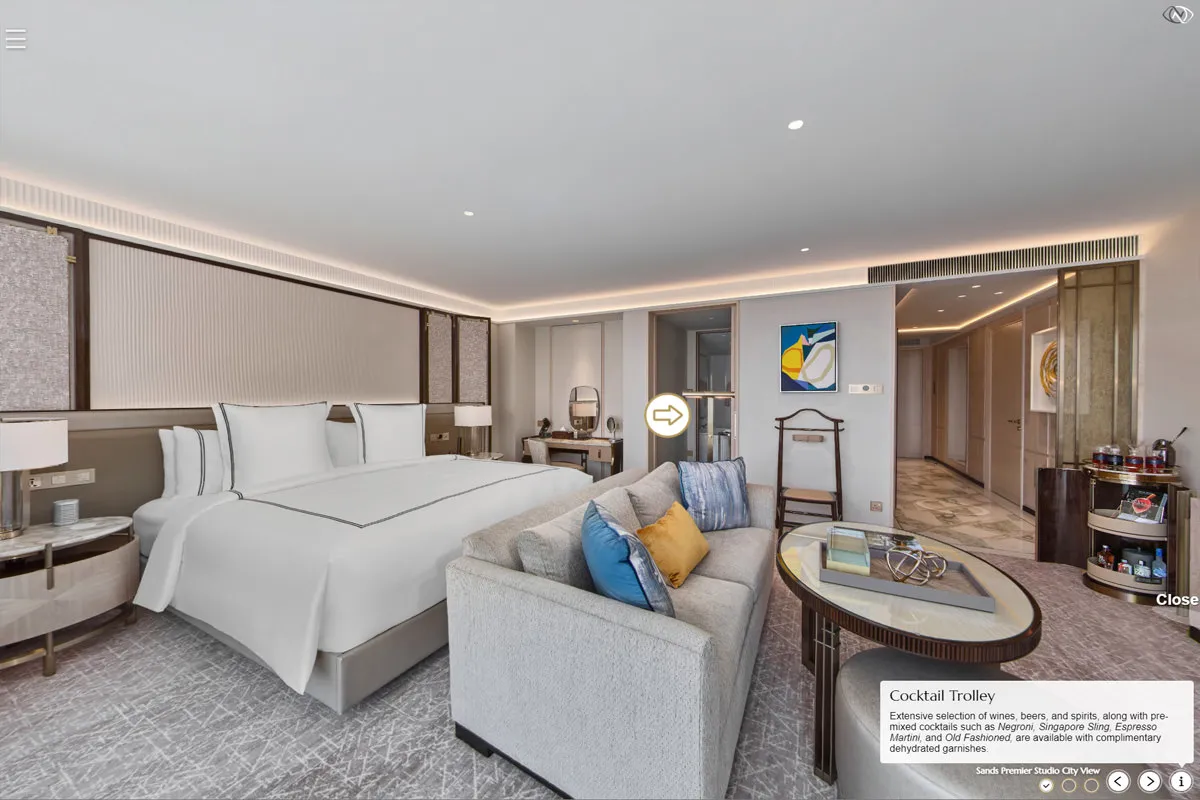 Premier Studio king bed with sofa and cocktail trolley at Marina Bay Sands hotel virtual tour
