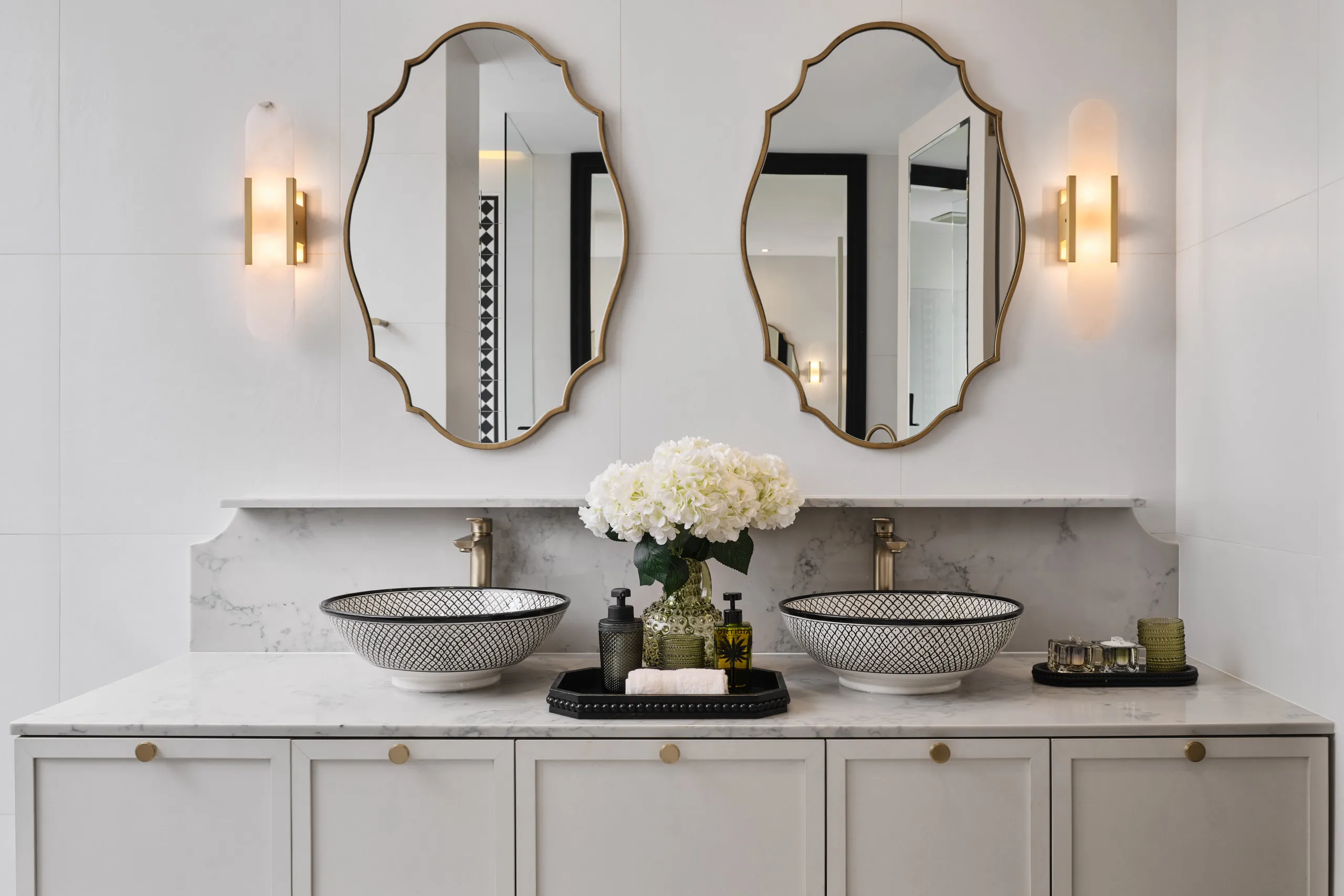 Luxury residential interior photography Singapore - spa-like master bathroom with marble vanity and sophisticated lighting design