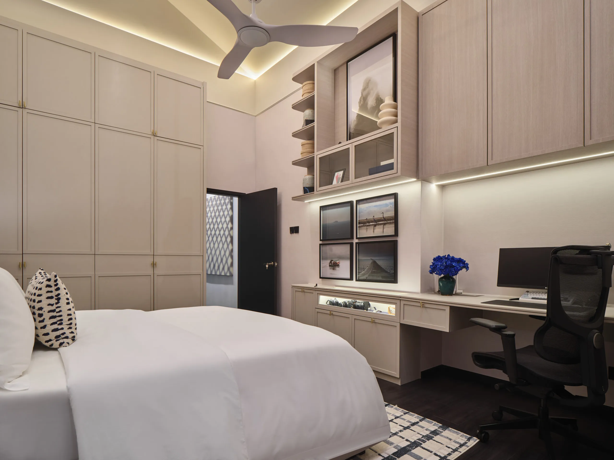 Modern residential interior photography Singapore - sleek bedroom design with black built-in cabinetry and integrated lighting in Bedok