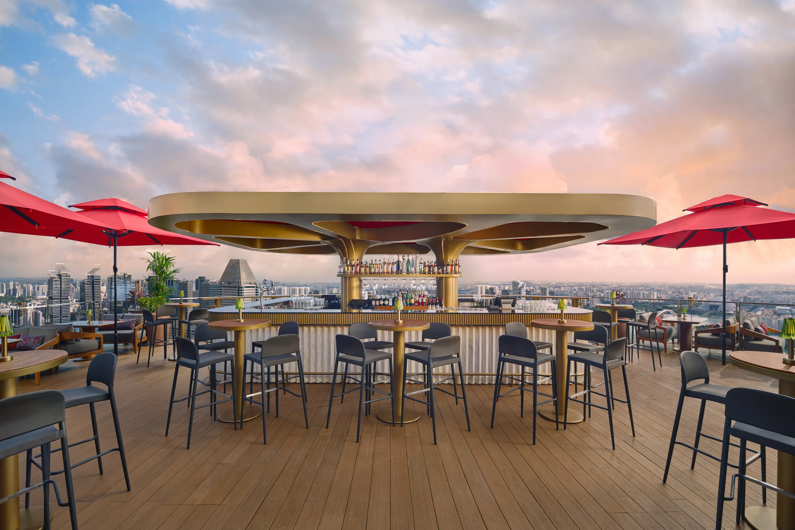 Dusk hospitality photography of the iconic CÉ LA VI Singapore skybar, capturing the stunning sunset and vibrant atmosphere of the rooftop lounge