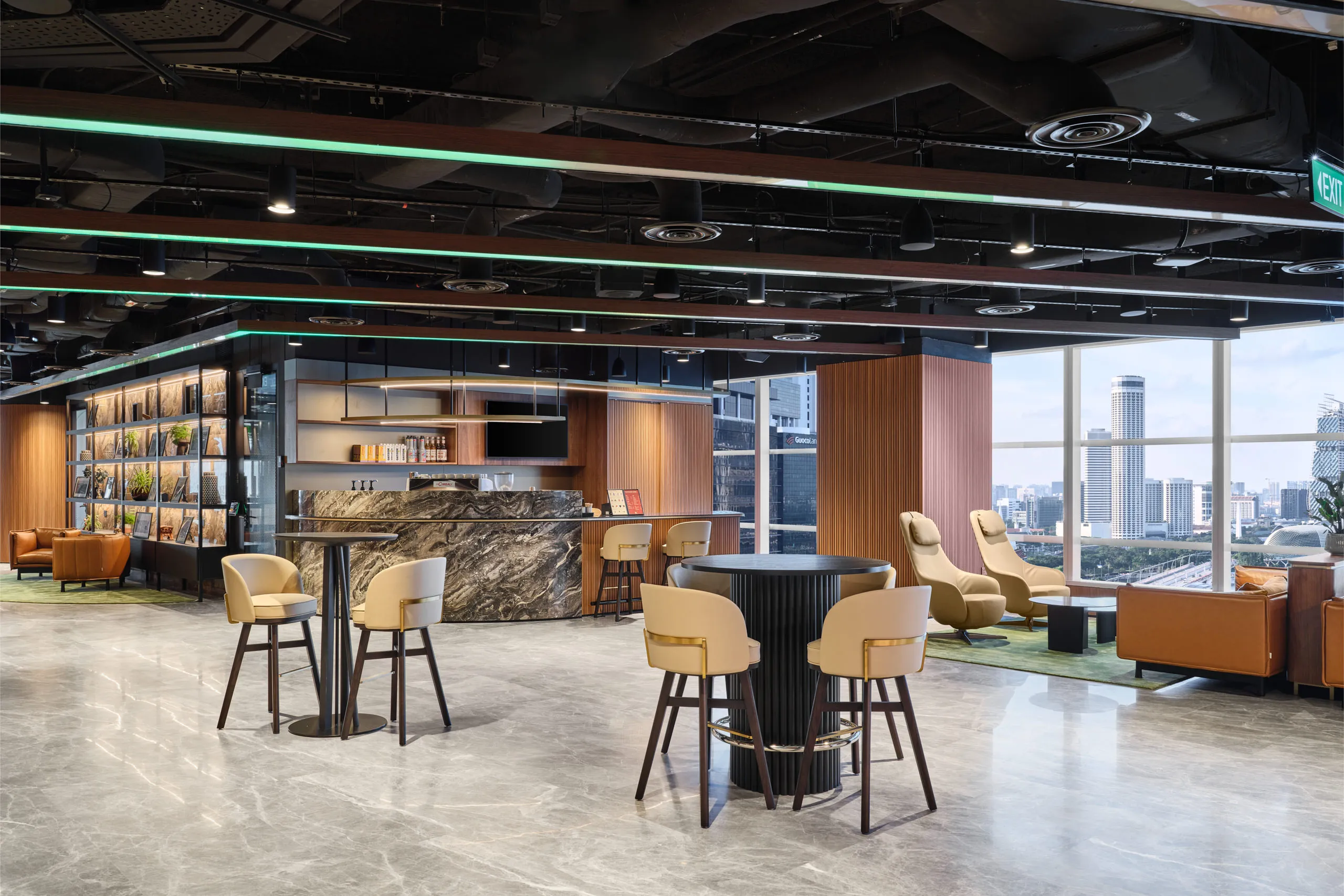 Cozy office library and quiet zone with warm, inviting lighting and fully stocked bookshelves, captured for a workplace photography portfolio.