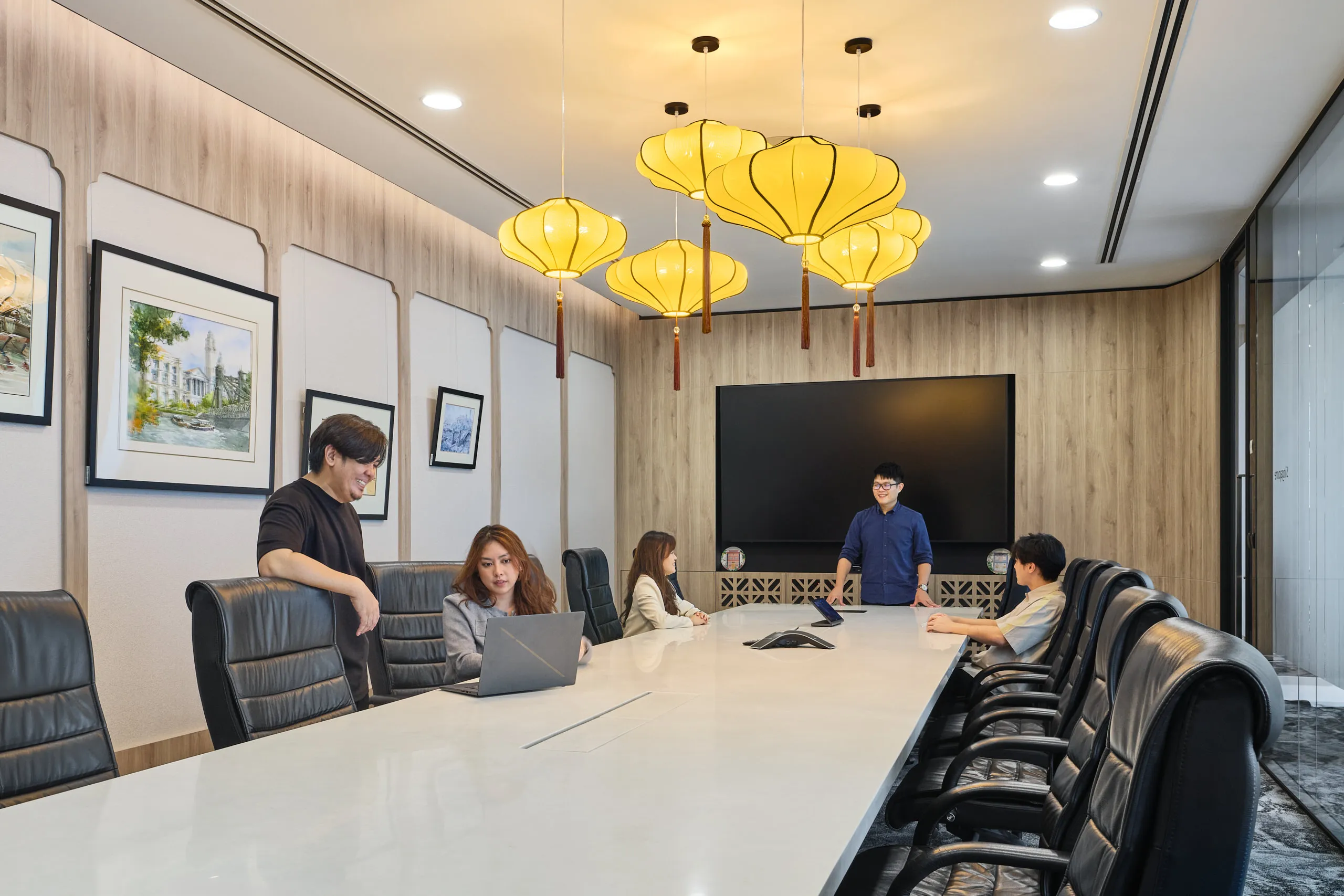 Heritage boardroom with silk lantern pendants and shophouse-inspired panels — Singapore office interior photography
